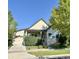 Beautiful single-story home with a front-facing garage, manicured lawn, mature landscaping, and charming curb appeal at 19 S 45Th Ave, Brighton, CO 80601