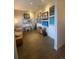 Comfortable living area features hardwood floors, diverse art collection, piano, and couch creating a cozy and inviting atmosphere at 19 S 45Th Ave, Brighton, CO 80601