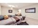 Inviting living room with a comfortable sectional sofa, artistic decor, and cozy lighting at 19 S 45Th Ave, Brighton, CO 80601