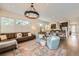 Stylish open concept living room with elegant chandelier and comfortable seating at 19 S 45Th Ave, Brighton, CO 80601