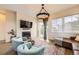 Cozy living room with fireplace, TV, and comfortable seating at 19 S 45Th Ave, Brighton, CO 80601