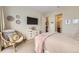Comfortable main bedroom featuring a TV, dresser, and ensuite bathroom at 19 S 45Th Ave, Brighton, CO 80601