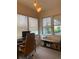 Bright office space features a modern desk setup, comfortable chair, natural light, and a sleek storage unit at 19 S 45Th Ave, Brighton, CO 80601