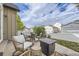 Charming patio with comfortable seating, fire pit, and a view of the neighborhood at 19 S 45Th Ave, Brighton, CO 80601