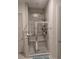 Modern bathroom with glass-enclosed shower, tiled walls, decorative mosaic tile, and a convenient built-in seat at 19 S 45Th Ave, Brighton, CO 80601