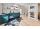 Finished basement wet bar area with dark green cabinets and stylish tile flooring at 8739 Culebra St, Arvada, CO 80007