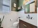 Stylish powder room featuring wainscoting, a modern vanity, and sophisticated decor at 8739 Culebra St, Arvada, CO 80007