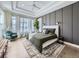 Tranquil main bedroom suite with coffered ceilings, ample natural light, and stylish accents at 8739 Culebra St, Arvada, CO 80007