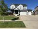 Charming two-story home with a three-car garage and beautifully landscaped front yard at 8739 Culebra St, Arvada, CO 80007