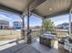 Relaxing front porch with stone columns and an outdoor seating area, perfect for enjoying the neighborhood views at 8739 Culebra St, Arvada, CO 80007