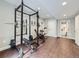 Well-equipped home gym featuring weight rack and bench, with access to the modern bathroom at 8739 Culebra St, Arvada, CO 80007