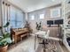 Inviting living space with a piano, desks, and a decorative rug creating a comfortable and functional area at 8739 Culebra St, Arvada, CO 80007