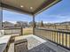 Inviting covered porch with comfortable seating and views of the neighborhood at 8739 Culebra St, Arvada, CO 80007