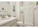 Clean bathroom featuring modern fixtures, glass shower, and stylish vanity with ample storage at 5227 Lake Port Ave, Longmont, CO 80504