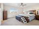 Cozy bedroom featuring a large window, soft lighting, and comfortable furnishings at 5227 Lake Port Ave, Longmont, CO 80504