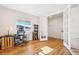 Bright office featuring hardwood floors, natural light, and a functional workspace at 5227 Lake Port Ave, Longmont, CO 80504