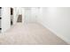Finished basement area with new carpet, access to stairs and a large sliding-door closet at 655 Cree Cir, Boulder, CO 80303