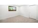 Bright bedroom with neutral carpeting, a window, and a closet with sliding doors at 655 Cree Cir, Boulder, CO 80303