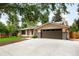Charming home featuring an attached garage, neutral color palette, and well-maintained landscaping at 655 Cree Cir, Boulder, CO 80303