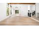 Bright living area with light wood floors, wood beam and access to the yard at 655 Cree Cir, Boulder, CO 80303