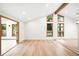 Open living room with hardwood floors, high ceilings, and lots of natural light at 655 Cree Cir, Boulder, CO 80303