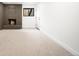Cozy living room featuring a brick fireplace with a hearth and ample space for furniture at 655 Cree Cir, Boulder, CO 80303