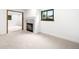 Bright living room features a fireplace, neutral carpet, and stylish trim throughout at 655 Cree Cir, Boulder, CO 80303