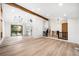 Bright living area with light wood floors, wood beam and access to the yard at 655 Cree Cir, Boulder, CO 80303