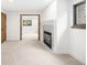 Bright living room features a fireplace, neutral carpet, and stylish trim throughout at 655 Cree Cir, Boulder, CO 80303