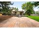 Large backyard patio perfect for outdoor entertainment, surrounded by mature trees and landscaping at 655 Cree Cir, Boulder, CO 80303