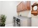 Functional laundry room equipped with modern washer and dryer units at 9550 Firenze Way, Highlands Ranch, CO 80126