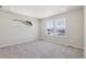 Bright bedroom features neutral walls, plush carpeting and natural light from large double-paned windows at 7245 Goldbloom Ln, Littleton, CO 80125