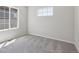 Neutral bedroom with wall-to-wall carpet and ample natural light at 7245 Goldbloom Ln, Littleton, CO 80125