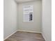 Bedroom with neutral walls, hardwood flooring, and natural light from window at 7245 Goldbloom Ln, Littleton, CO 80125