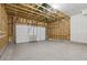 Spacious two-car garage with concrete floors and automatic door at 7245 Goldbloom Ln, Littleton, CO 80125