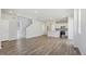 Open-concept living space featuring an adjoining kitchen and staircase at 7245 Goldbloom Ln, Littleton, CO 80125