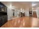 Spacious basement featuring hardwood floors, mirrored wall, and custom built-in shelving for ample storage at 1572 Leyden St, Denver, CO 80220