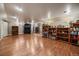 Spacious basement area with hardwood floors and built-in shelving at 1572 Leyden St, Denver, CO 80220