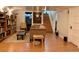 Finished basement with a seating area and staircase at 1572 Leyden St, Denver, CO 80220