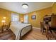 Cozy bedroom with hardwood floors, a desk, and natural lighting at 1572 Leyden St, Denver, CO 80220