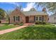 Charming brick home with well-maintained front yard, walkway, and inviting curb appeal at 1572 Leyden St, Denver, CO 80220