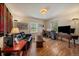 Comfortable living room with hardwood floors, a desk and large windows at 1572 Leyden St, Denver, CO 80220