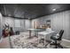 Versatile basement area with stylish wood-look paneling, ample natural light, and a cozy atmosphere at 3378 Shoveler Trl, Castle Rock, CO 80104