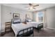 Charming bedroom with two twin beds, bright windows, and neutral-colored walls and carpet at 3378 Shoveler Trl, Castle Rock, CO 80104