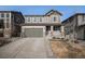 Charming two-story home showcasing a two-car garage and well-maintained landscaping at 3378 Shoveler Trl, Castle Rock, CO 80104