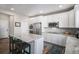Stylish kitchen features a large center island, stainless steel appliances, and granite countertops at 3378 Shoveler Trl, Castle Rock, CO 80104