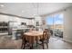 Modern kitchen with an adjacent dining area and views of the outdoor deck at 3378 Shoveler Trl, Castle Rock, CO 80104