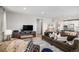 Open-concept living space that seamlessly connects to the dining area and kitchen at 3378 Shoveler Trl, Castle Rock, CO 80104