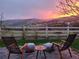 Outdoor patio features stunning mountain views, stylish seating, and lush landscaping at 3378 Shoveler Trl, Castle Rock, CO 80104