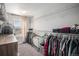 Spacious walk-in closet with ample shelving, hanging racks, and a view from the window at 3378 Shoveler Trl, Castle Rock, CO 80104